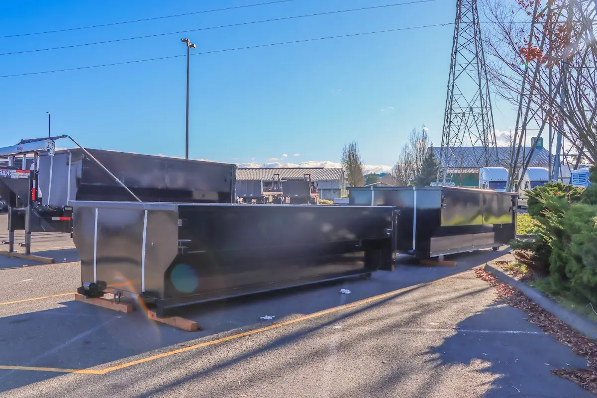 Roll-off dumpster ready for waste disposal at job site for 3 Yard Dumpster Rental in Winchester